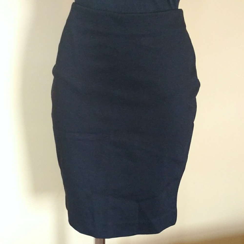 High-waist, stretchy pencil skirt with zipper.